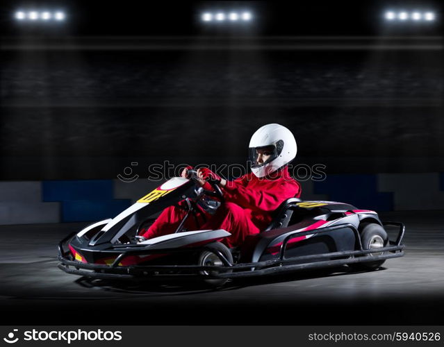 Young girl karting racer at stadium