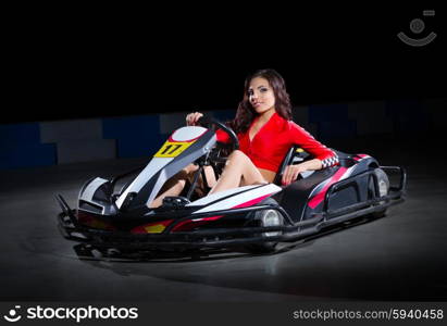 Young girl karting racer isolated