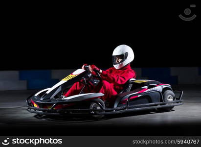 Young girl karting racer isolated