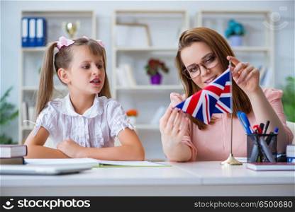 Young girl learning english with teacher