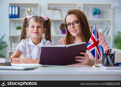 Young girl learning english with teacher