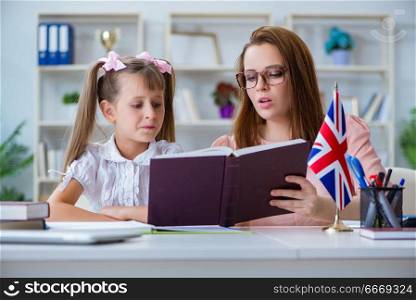 Young girl learning english with teacher