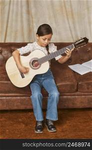 young girl learning how play guitar home 6