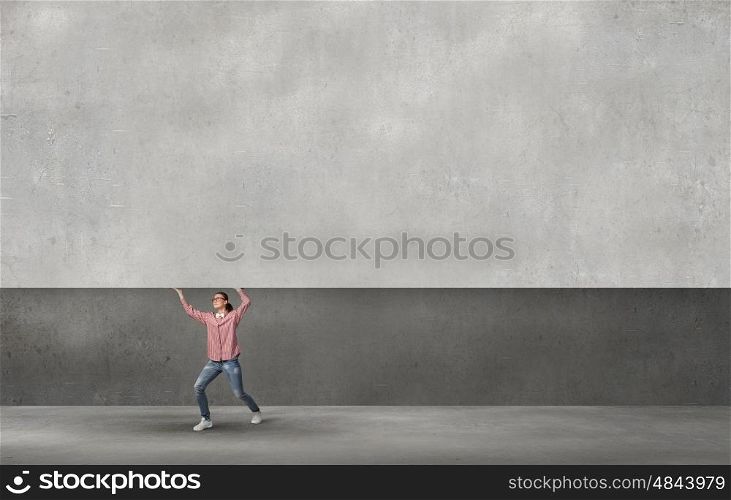 Young girl lifting cement banner place for text. Banner for advertisement