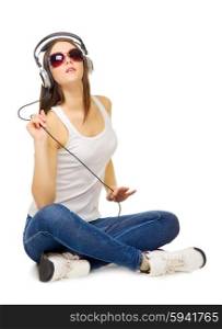 Young girl listening misoc by headphones isolated