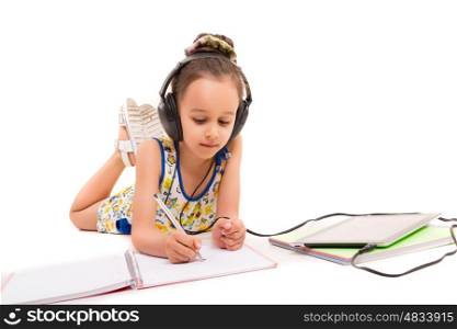Young girl listening to some music and making a new draw