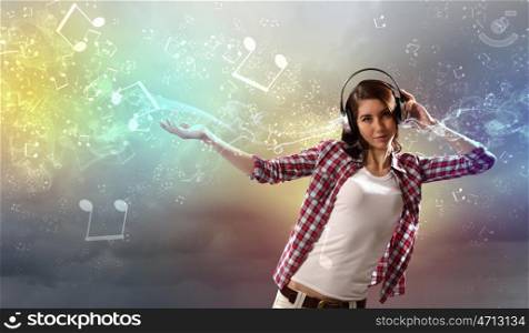 Young girl listens to music. Young girl listens to music. Modulations of color and light.