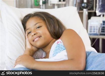 Young Girl Lying Down In Hospital Bed