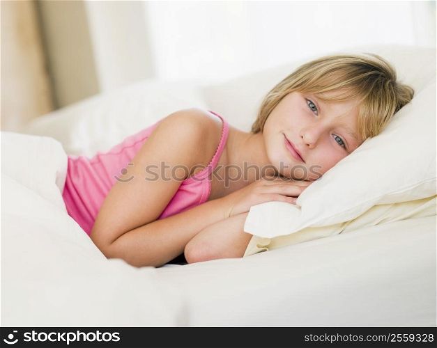 Young Girl Lying In Her Bed