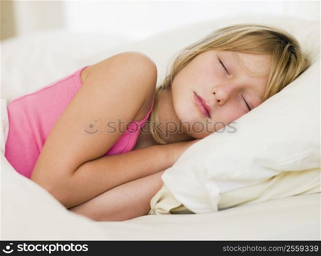 Young Girl Lying In Her Bed