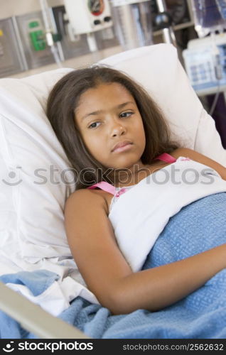 Young Girl Lying In Hospital Bed