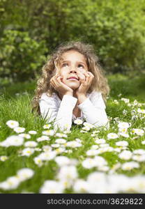 Young girl lying in the grass relaxing