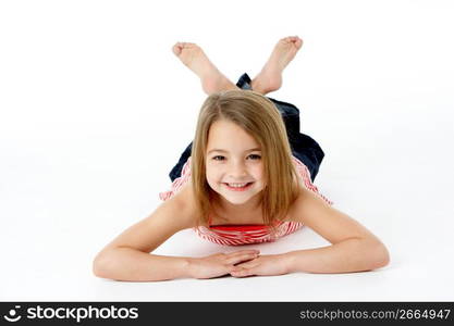 Young Girl Lying On Stomach In Studio