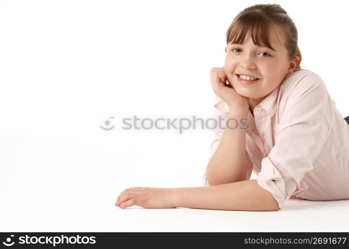 Young Girl Lying On Stomach In Studio