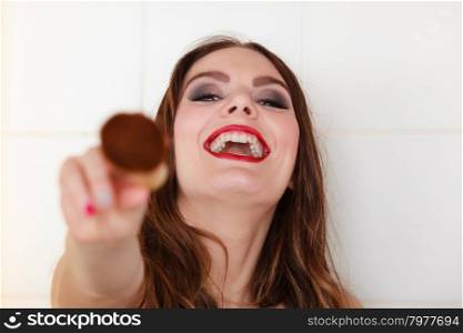 Young girl making makeup. Smiling girl making makeup in bathroom. Woman take care about look.