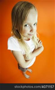 Young girl on an orange background
