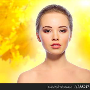 Young girl on autumnal background