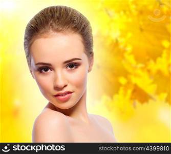 Young girl on autumnal background