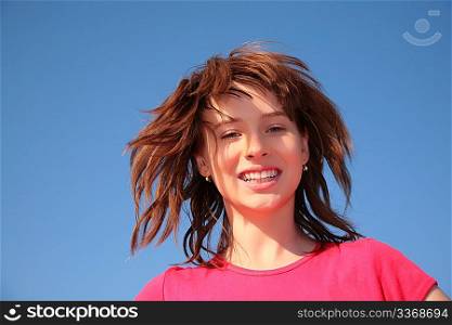 young girl on blue sky background