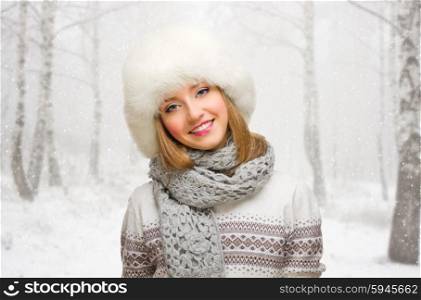 Young girl on snowy forest background