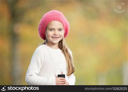 Young Girl Outdoors With MP3 Player