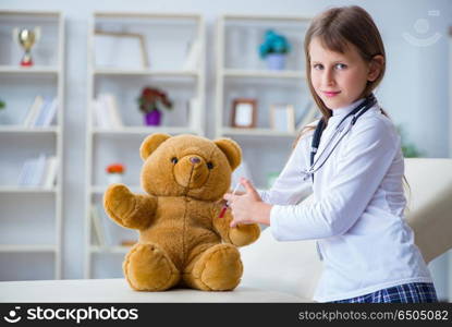 Young girl playing doctor in early development concept