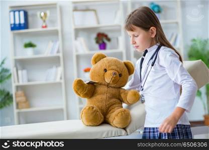 Young girl playing doctor in early development concept
