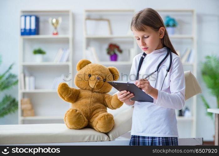 Young girl playing doctor in early development concept