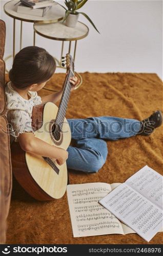 young girl playing guitar home 4