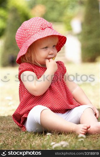 Young Girl Playing In Garden At Home