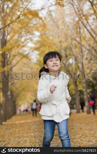 Young girl playing in park