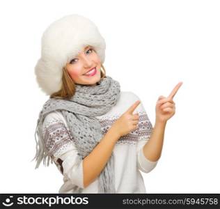Young girl points finger up isolated