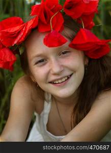 young girl portrait at the poppies field