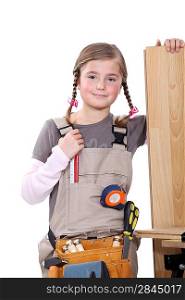Young girl pretending to be a construction worker