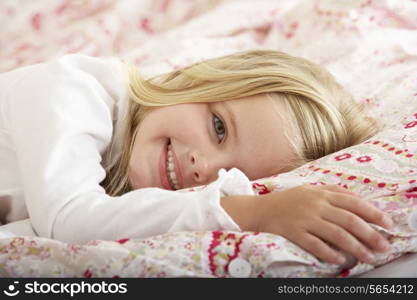 Young Girl Relaxing On Bed