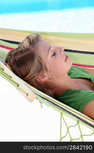 young girl resting in hammock