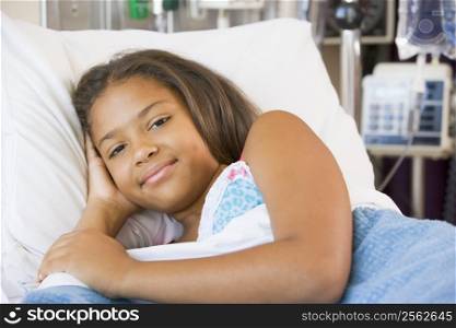 Young Girl Resting In Hospital Bed