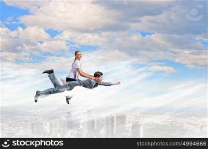 Young girl riding on back of her man. Woman riding man