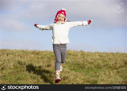 Young Girl Running In The Park