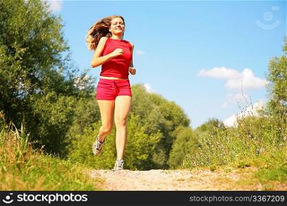 Young girl runs in forest