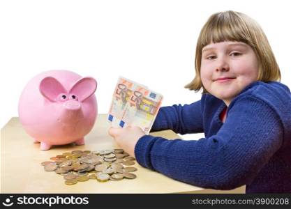 Young girl showing euro money notes and coins for piggy bank isolated on white background