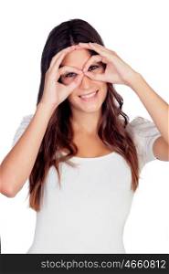 Young girl simulating glasses with his hands isolated on a white background