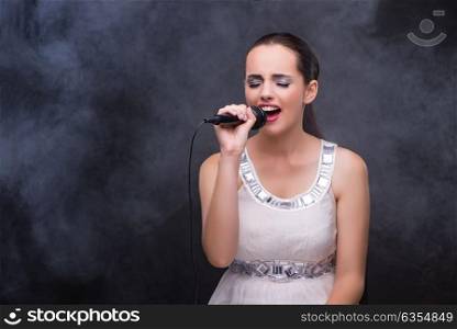 Young girl singing in karaoke club