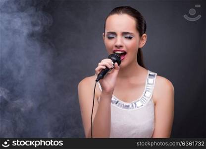 Young girl singing in karaoke club