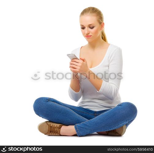 Young girl sit with mobile phone isolated