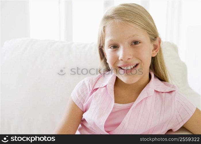 Young Girl Sitting On A Sofa