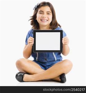 Young girl sitting on floor and showing something on a tablet