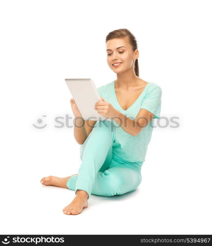 young girl sitting on the floor with tablet pc