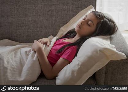 Young girl sleeping peacefully on the couch at home.  Children  