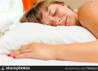 young girl sleeps in the bedroom afternoon